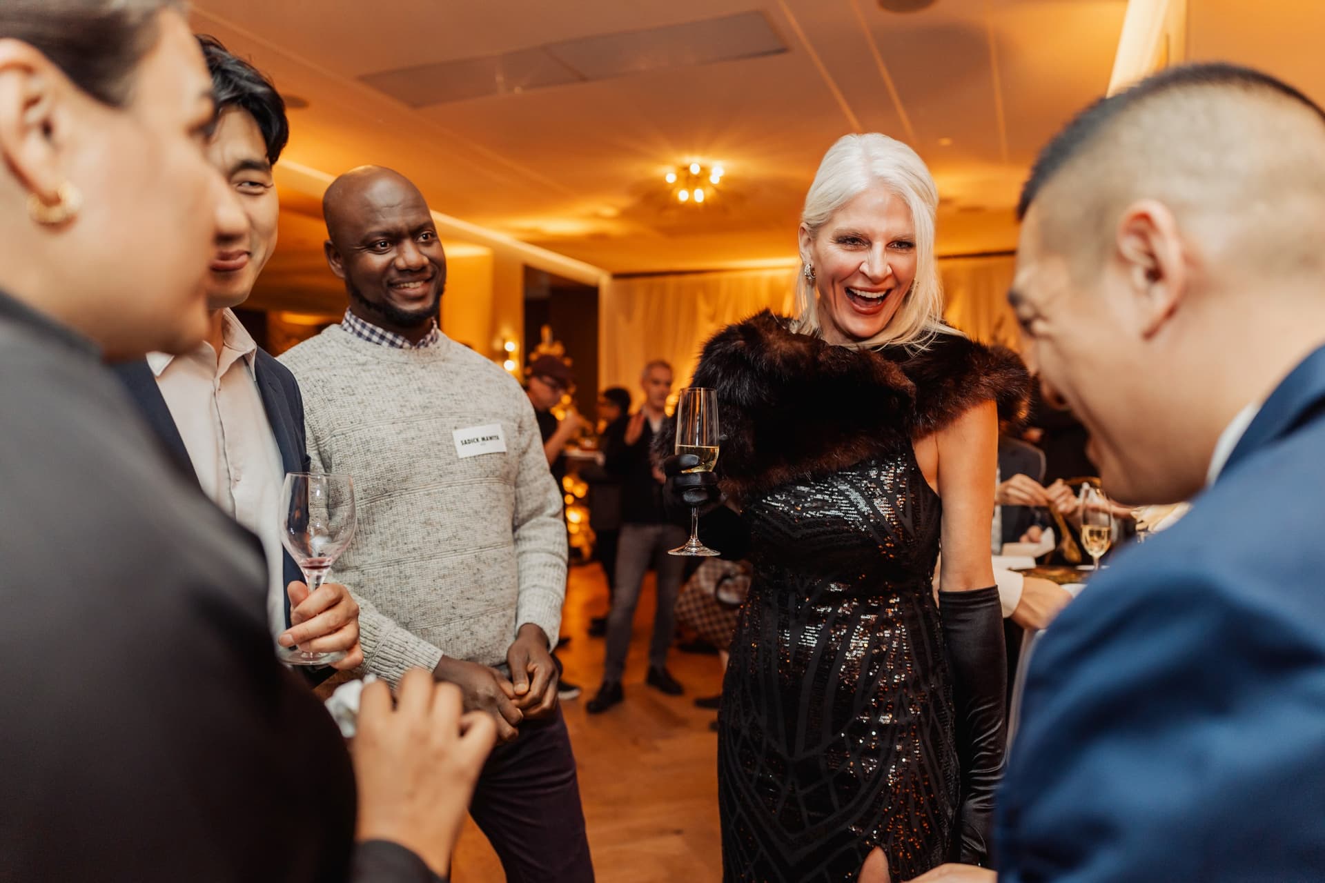 Corporate guests reacting to close-up magic by John Ha