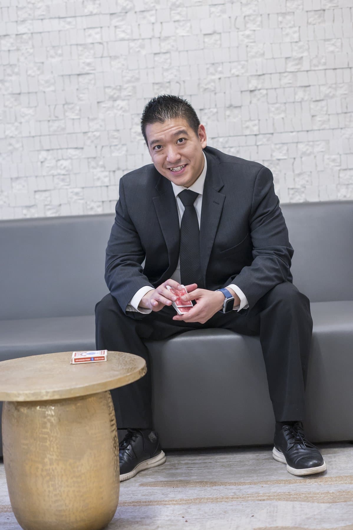 John Ha clearly visible with playing cards for a polished Ontario client event entertainment guide