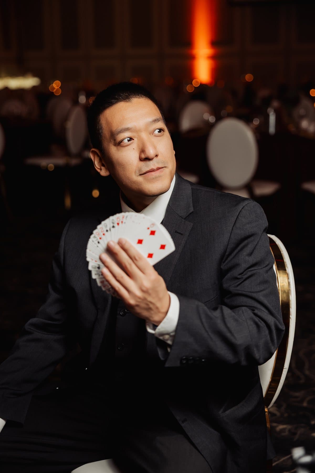 John Ha holding fanned playing cards