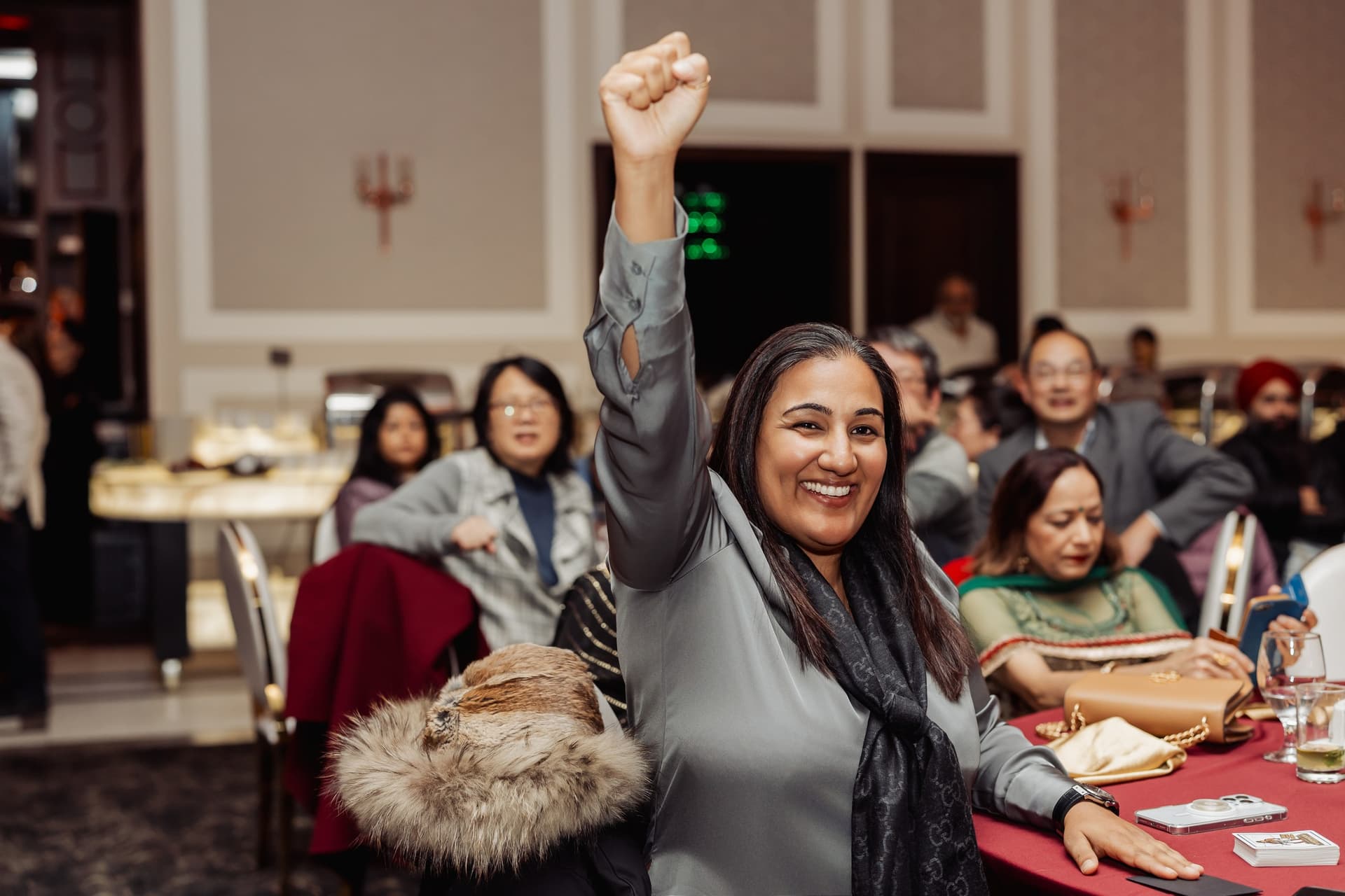 Holiday party guests reacting during a magic performance
